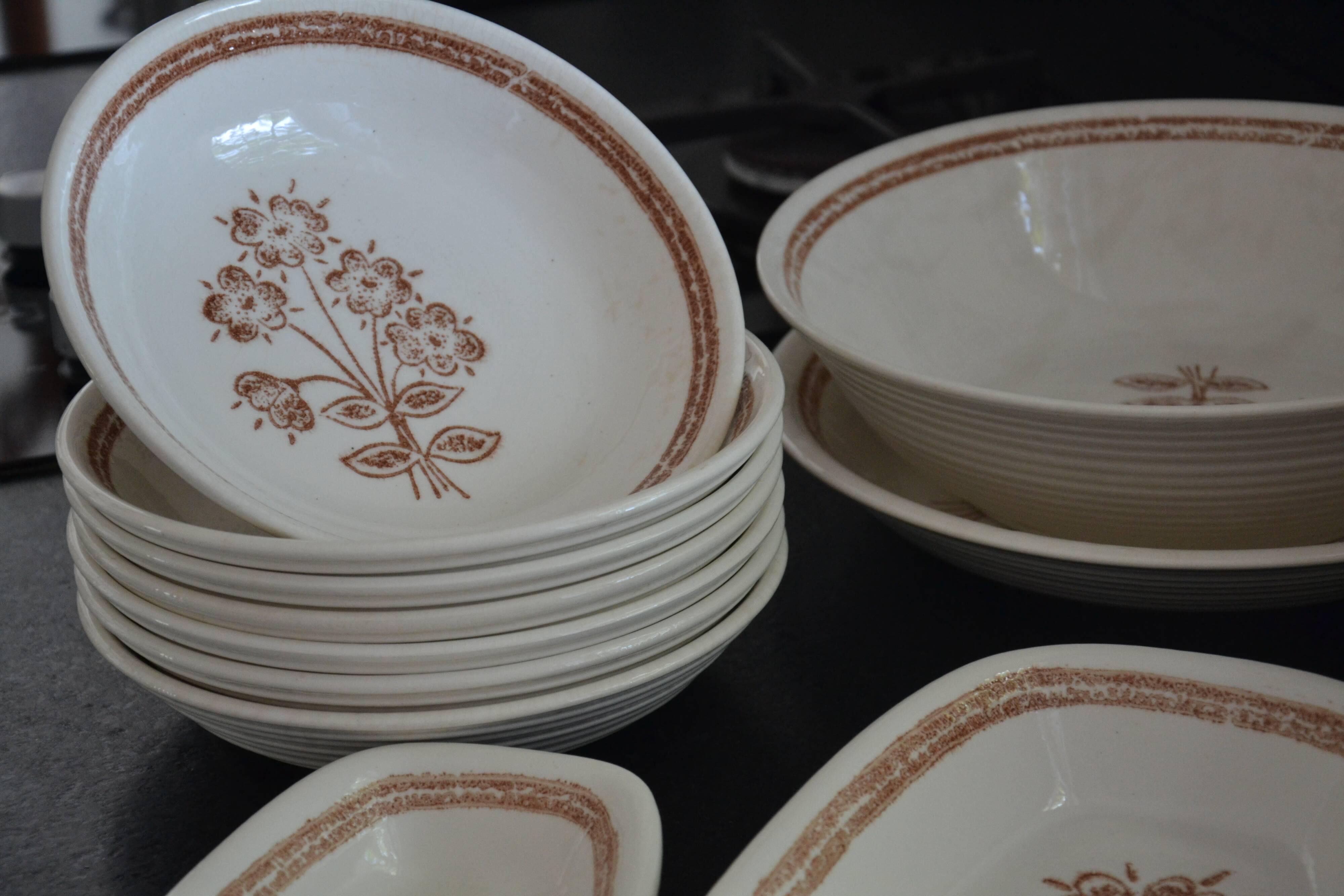 Set of 7 soup plates, dishes and a tureen with flower decoration