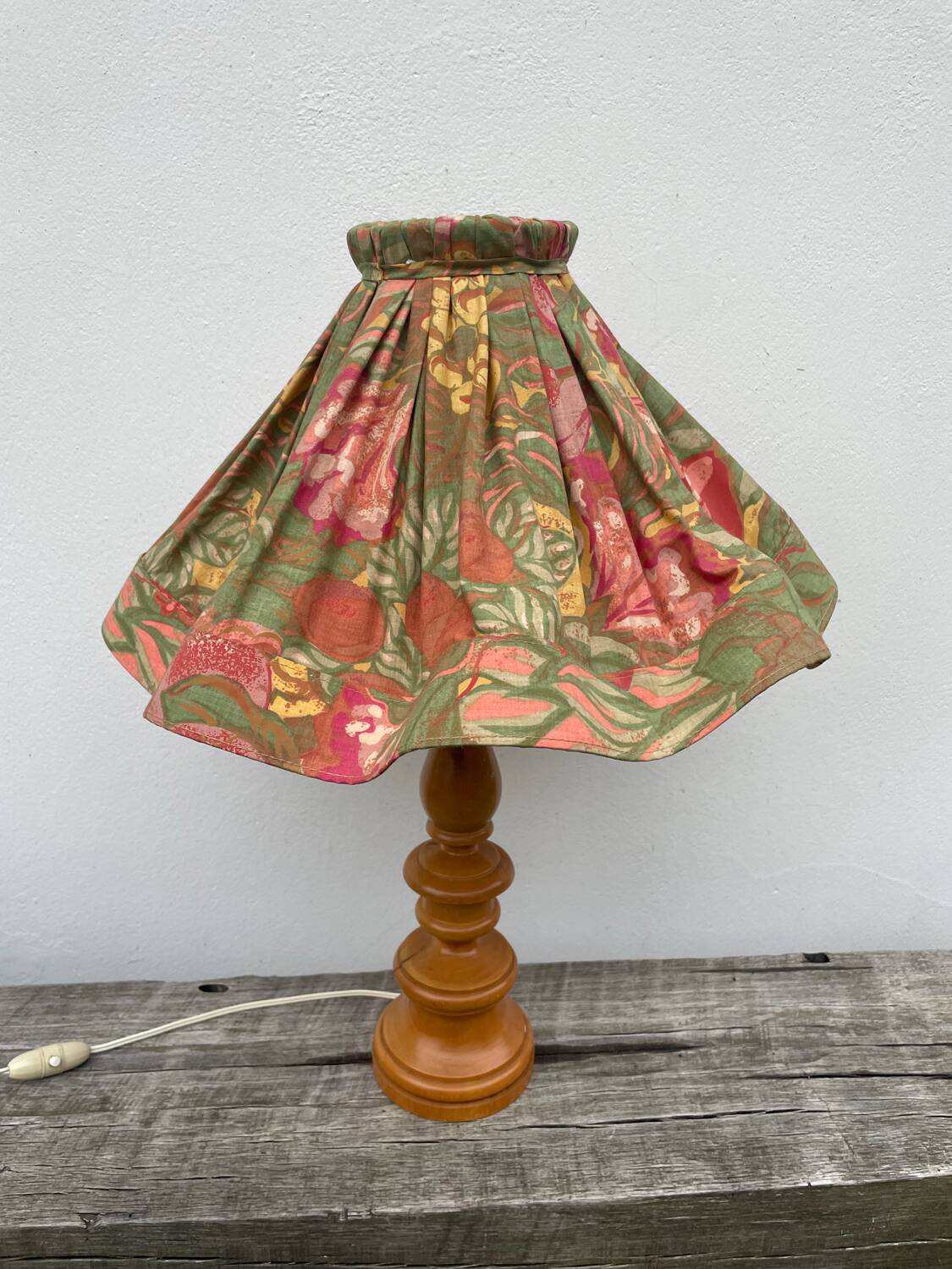 Turned wood lamp with flower shade