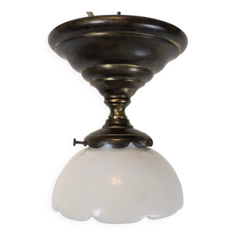 Art Deco ceiling light in patinated brass, a luminous piece with a muted charm.