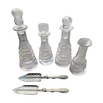4 old absinthe carafes with spoons