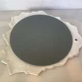 Ceramic mirror with serrated edge and a flower