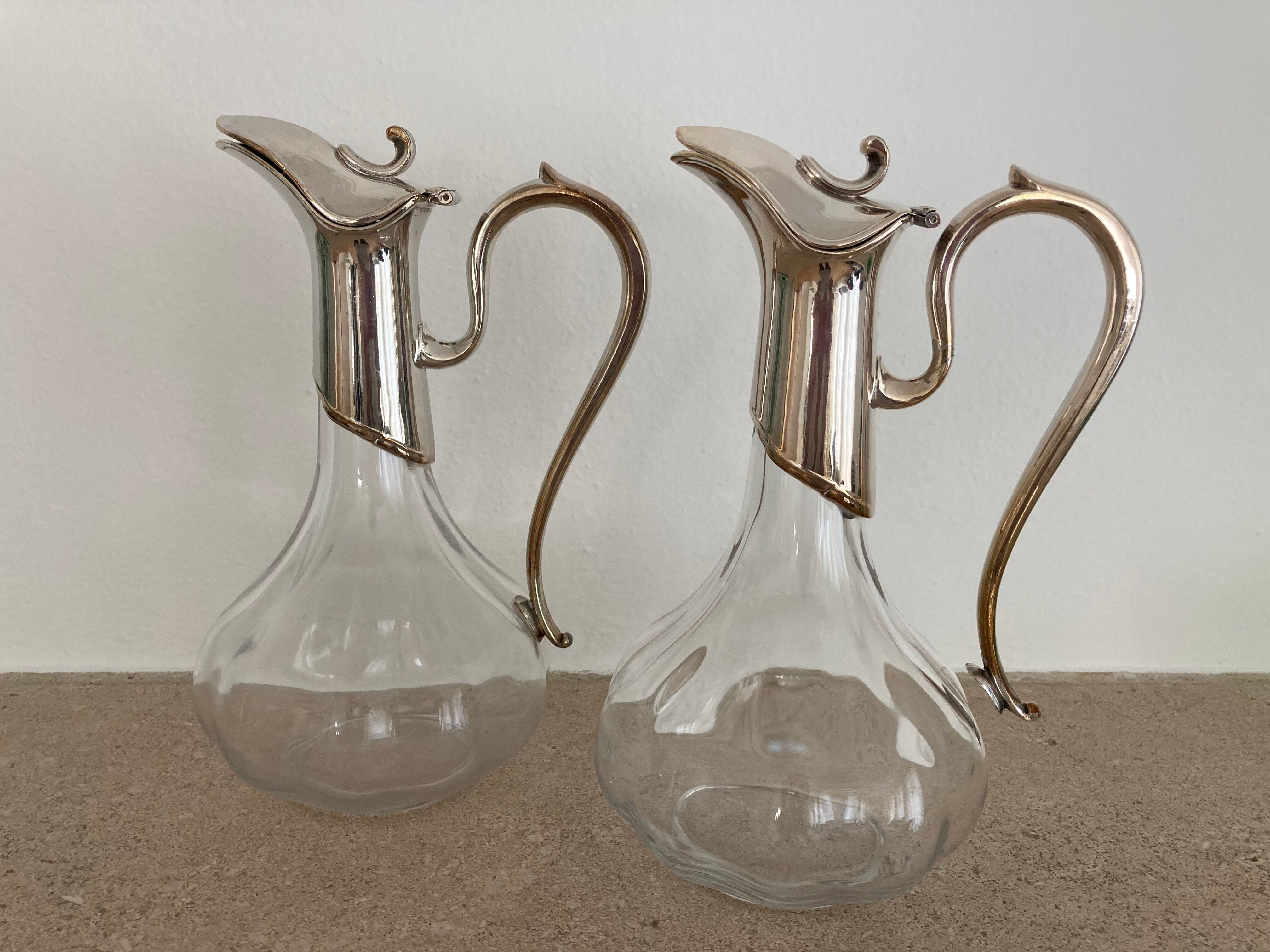Glass decanters and silver metal spouts
