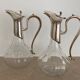 Glass decanters and silver metal spouts