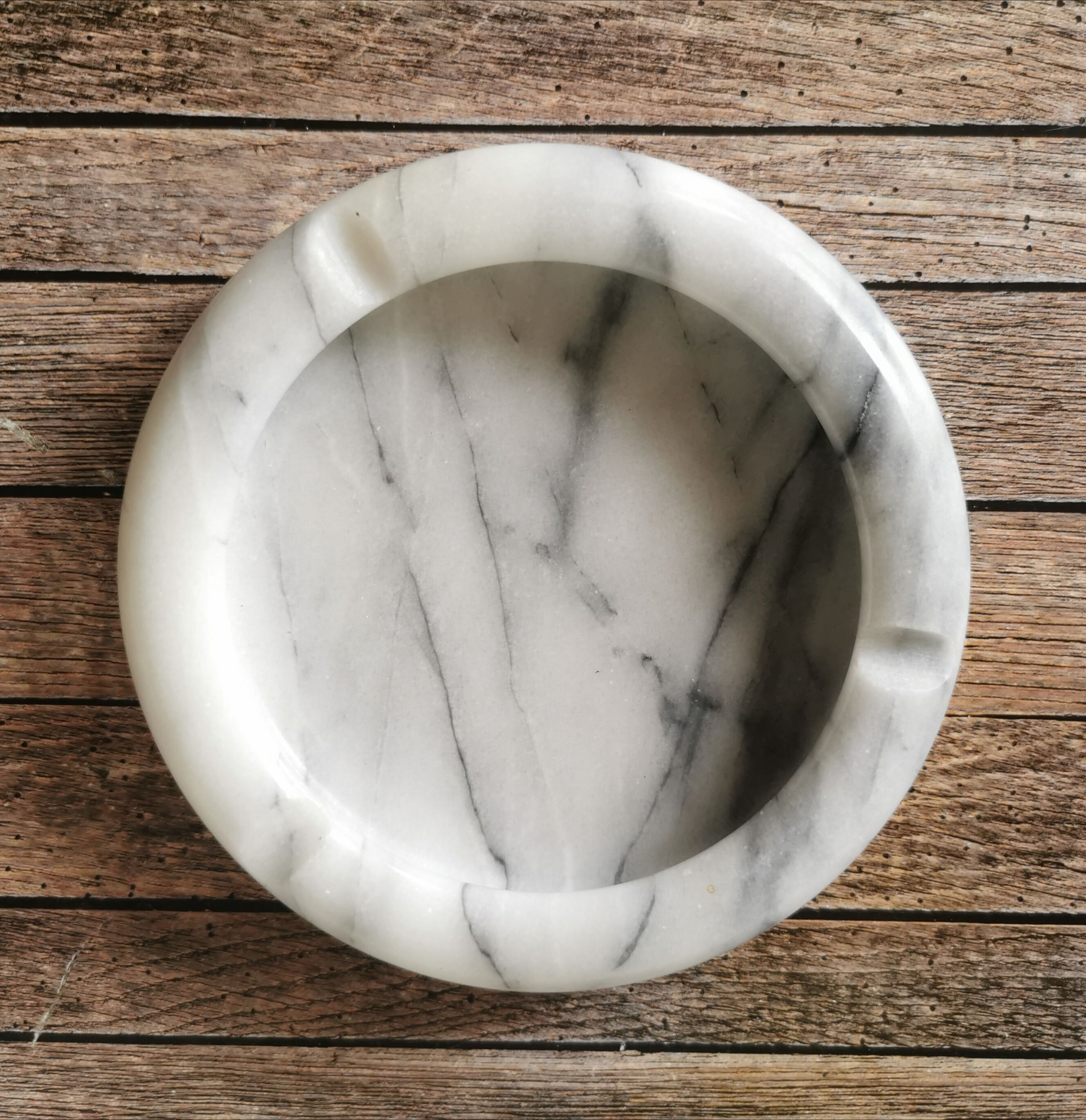 Ashtray and marble under glass
