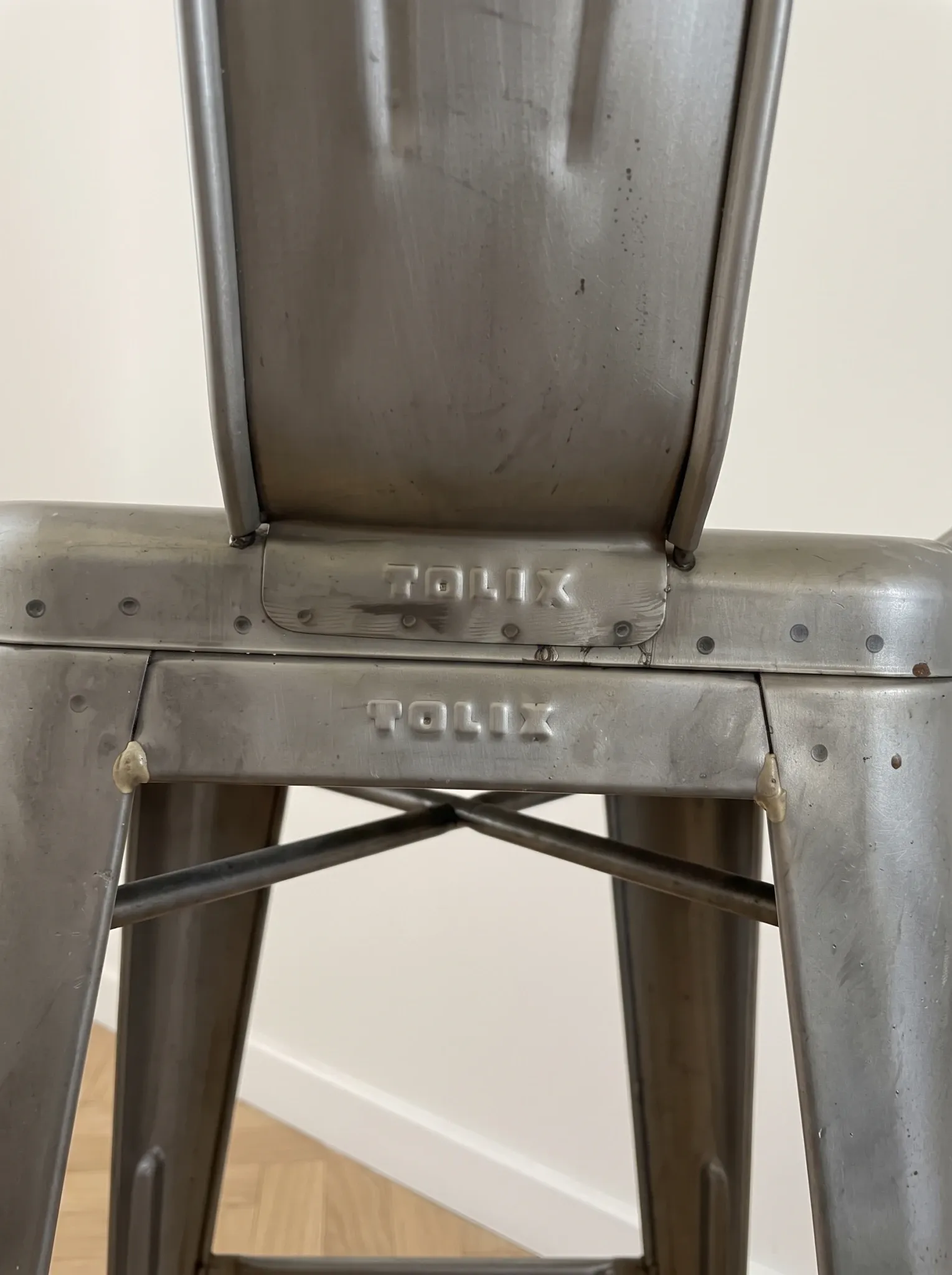 4 industrial grey metal Tolix bar stools