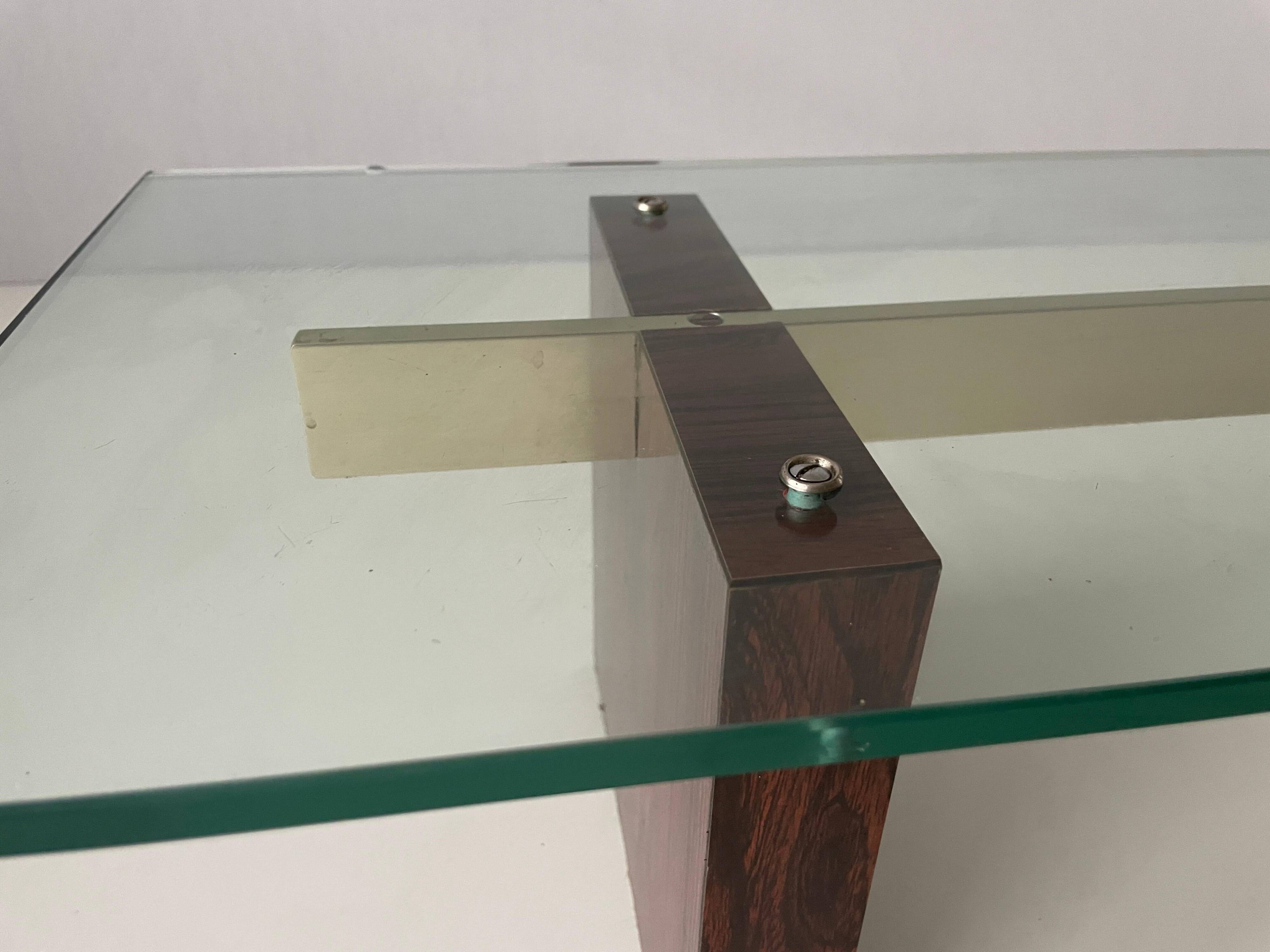 Mid-century minimalist thick glass coffee table, rosewood legs, 1960, Germany.