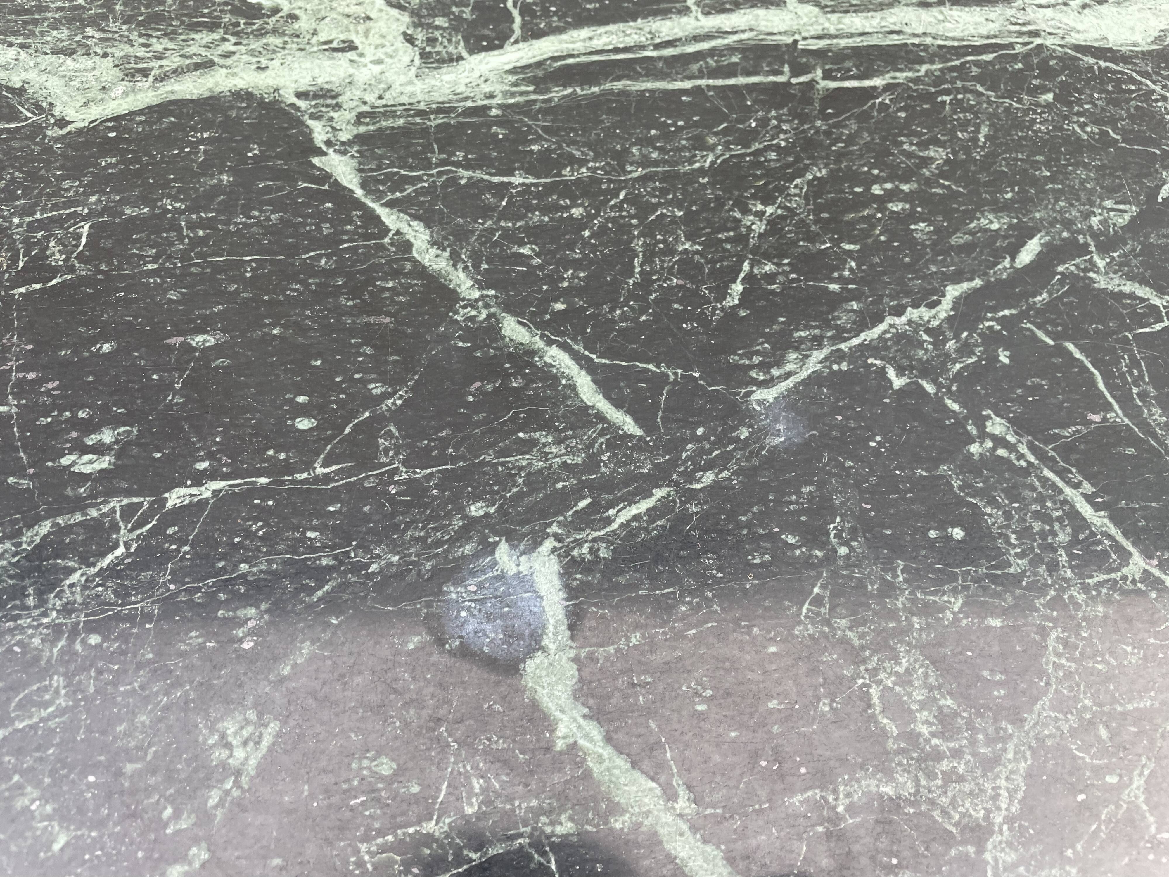 Coffee table in gilded brass and veined green marble