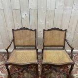Paire de fauteuils de style Louis XIII os de mouton en cannage.