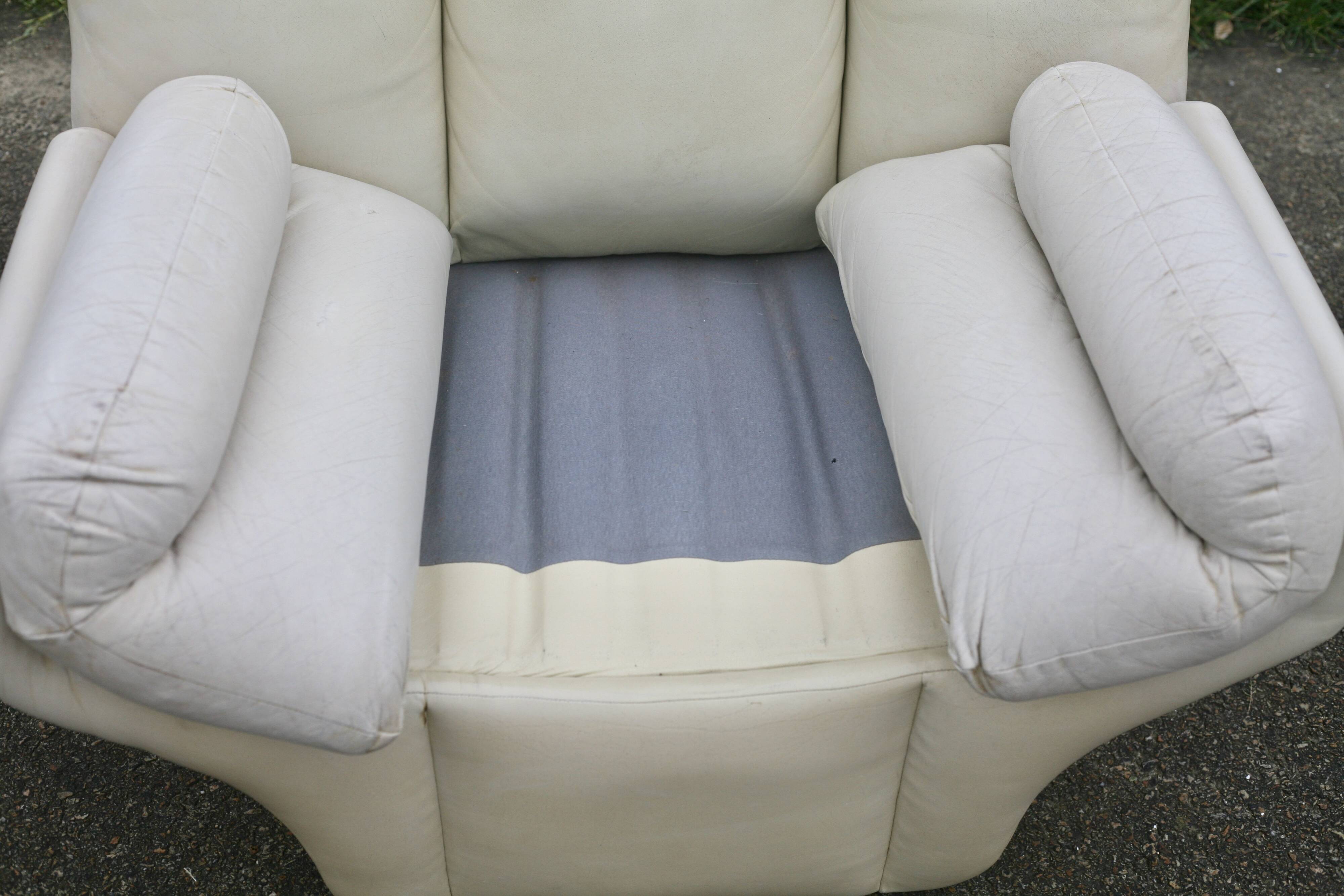 Pair of leather “space age” armchairs. Cream colour". Circa 1970.