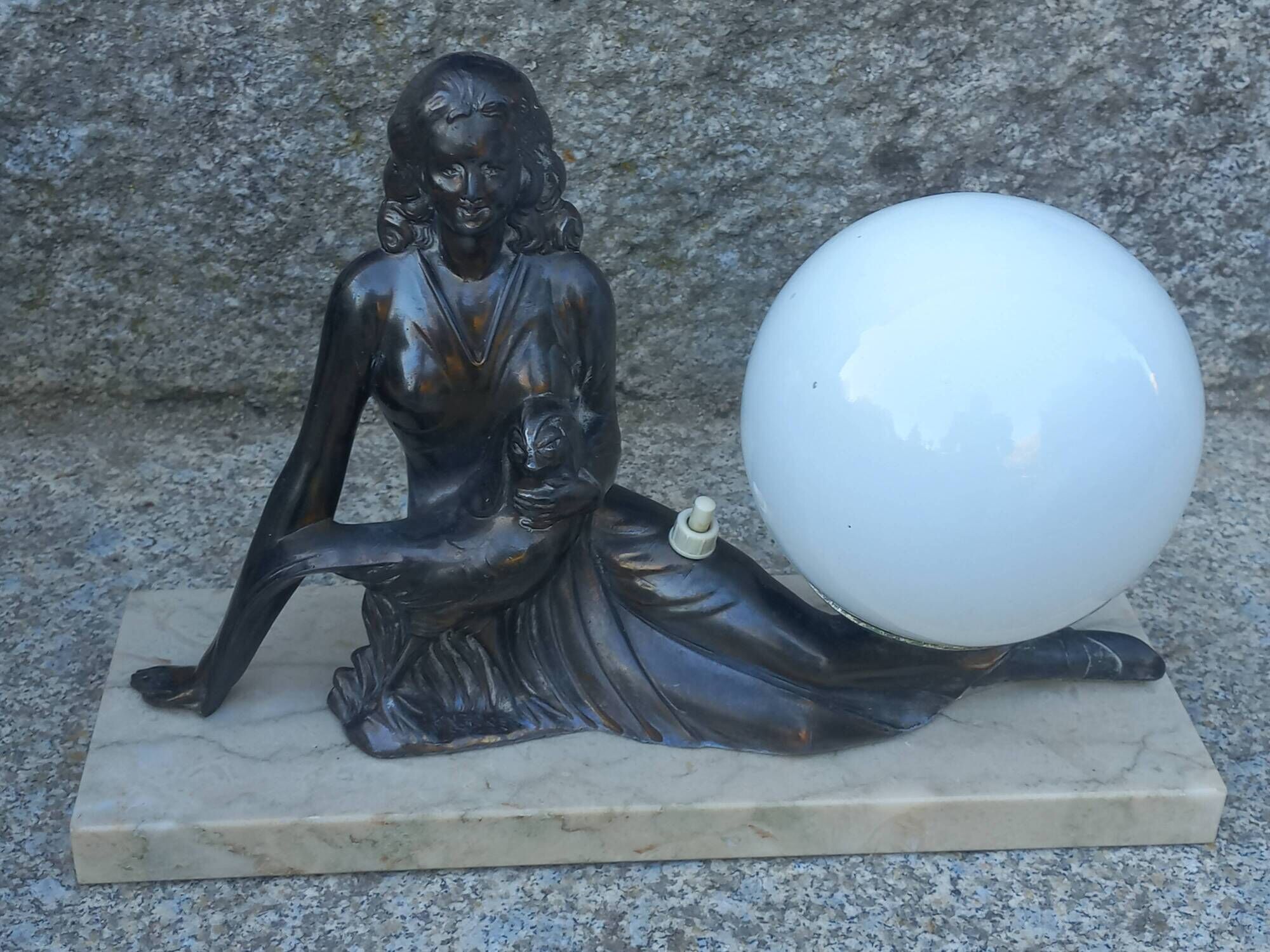 Art Deco lamp in cast iron and marble with a white opaline globe.