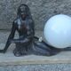 Art Deco lamp in cast iron and marble with a white opaline globe.