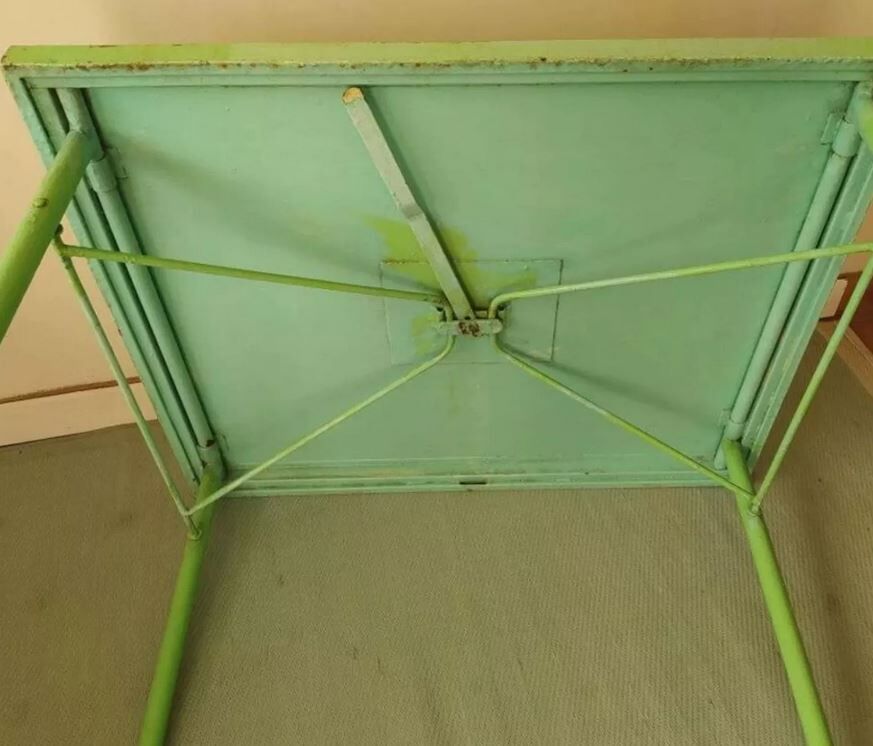 Green garden table in patinated metal