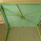 Green garden table in patinated metal