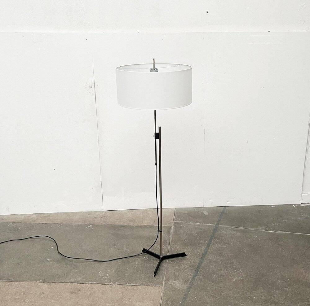 Mid-century German minimalist tripod floor lamp from the 1960s.