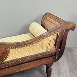 Louis XVI style meridian in carved wood and caning, 19th century.
