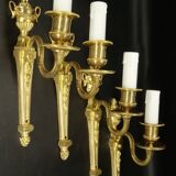 Suite de 4 appliques à 1 feu style Louis XVI du XIXe - bronze doré