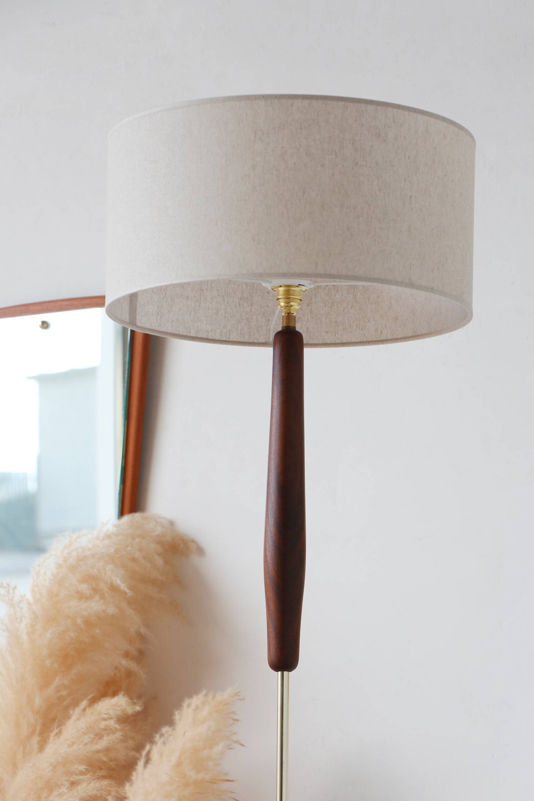 Vintage floor lamp in teak and brass with a cream shade.