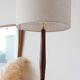 Vintage floor lamp in teak and brass with a cream shade.