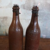 Set of 2 sandstone bottles with ceramic capsule