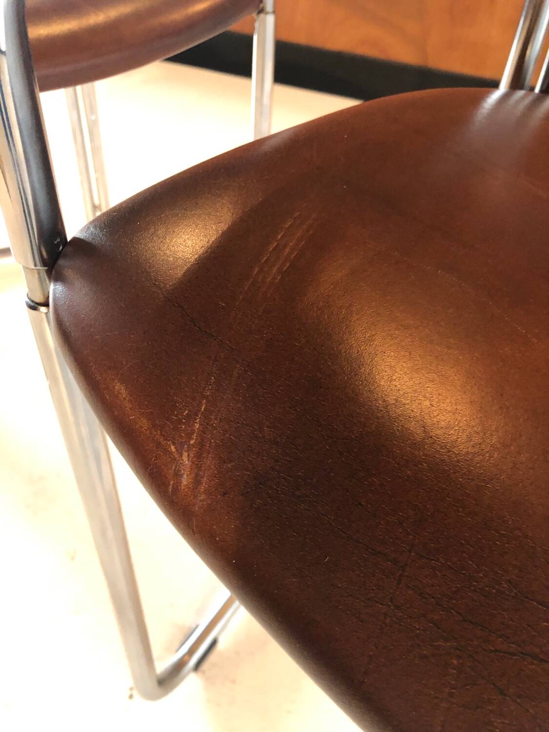 Pair of vintage armchairs, cognac leather and chrome steel 1970