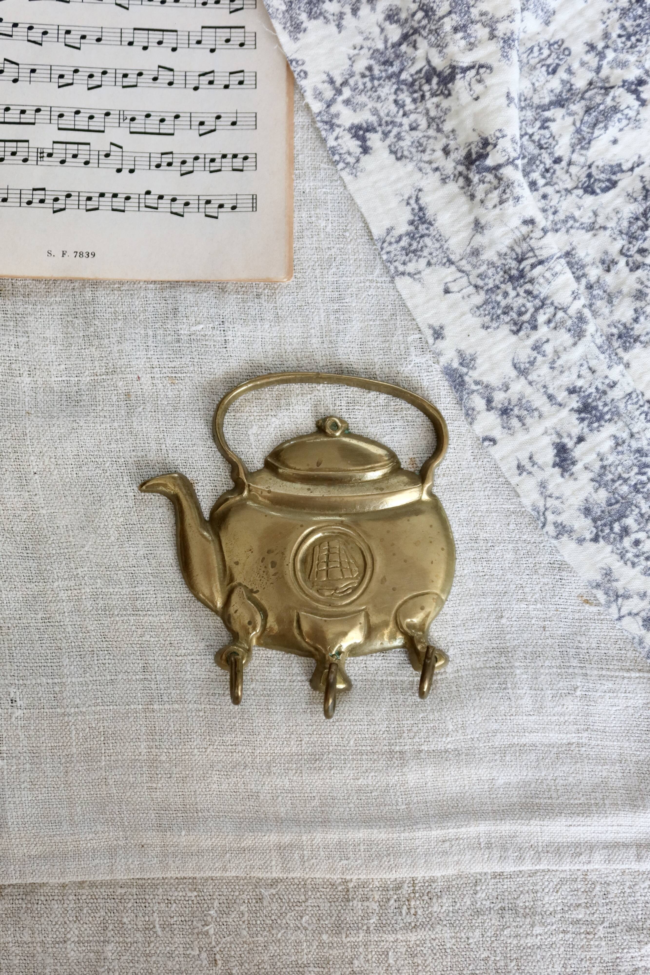 Vintage teapot-shaped brass coat hook