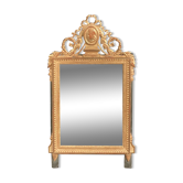 Louis XVI style mirror in gilded wood