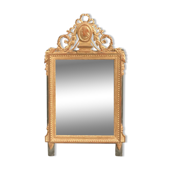 Louis XVI style mirror in gilded wood