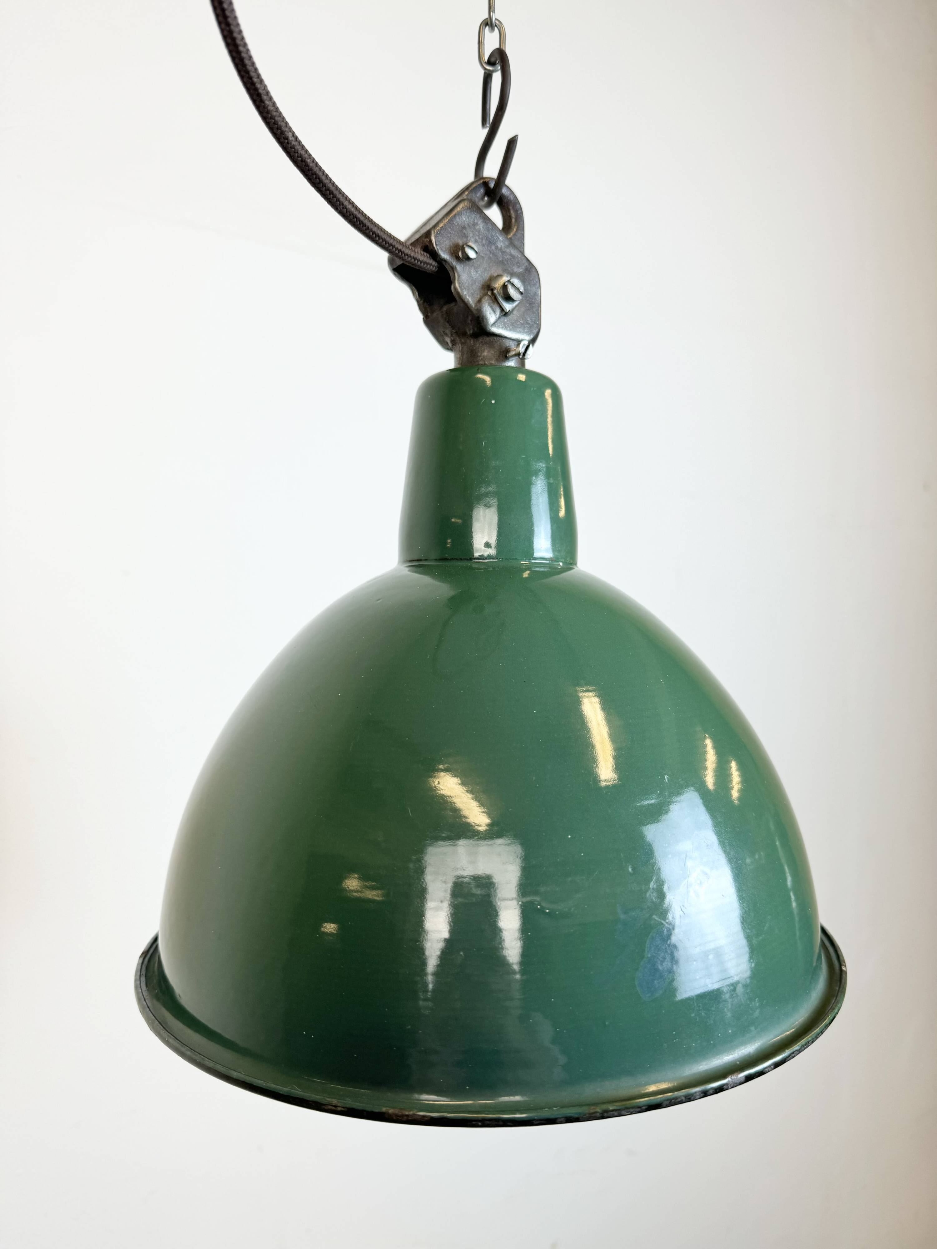 Industrial green enamel factory lamp with cast iron top, 1960s