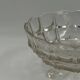Vintage pressed glass footed coupe with scalloped diamond-cut edge.