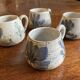 Ensemble de quatre tasses à café. Gustave Reynaud.