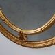 20th century neo-classical style tilted oval mirror by Deknudt, Belgium