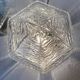 Pair of lantern-style ceiling lights or antique lamps.
