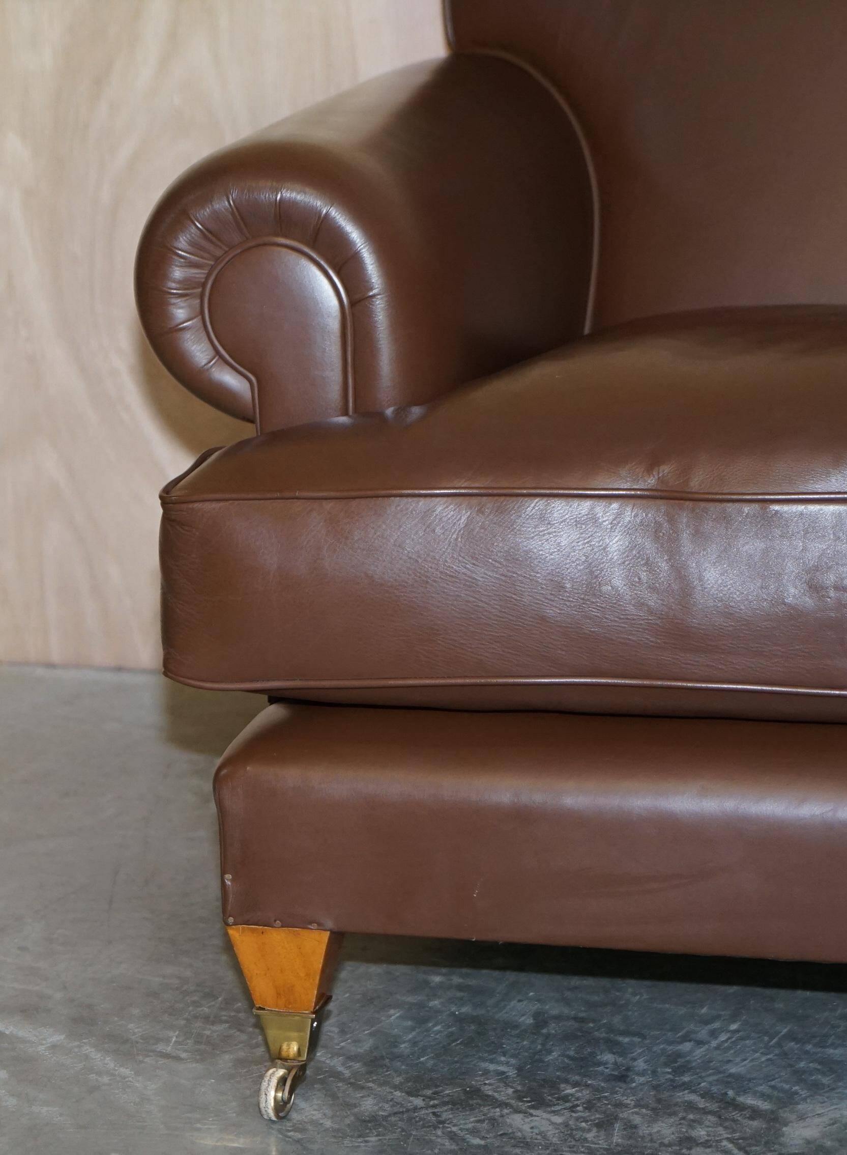 Contemporary Howard & Sons style grand sofa with brass casters.