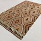 Grand kilim vintage motifs géométriques, tons terre et bleu pastel