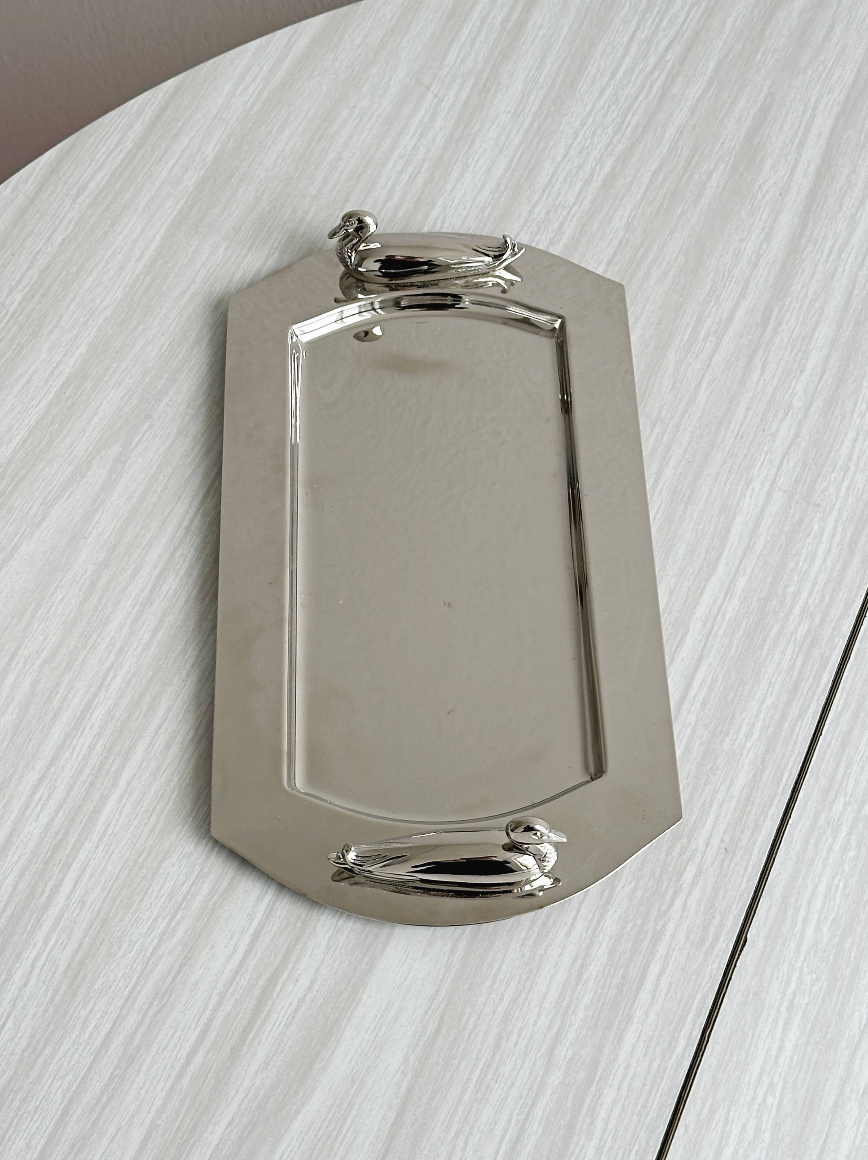 Shiny metal foie gras dish