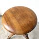 Tripod workshop stool in turned wood and cast iron — circa 1900