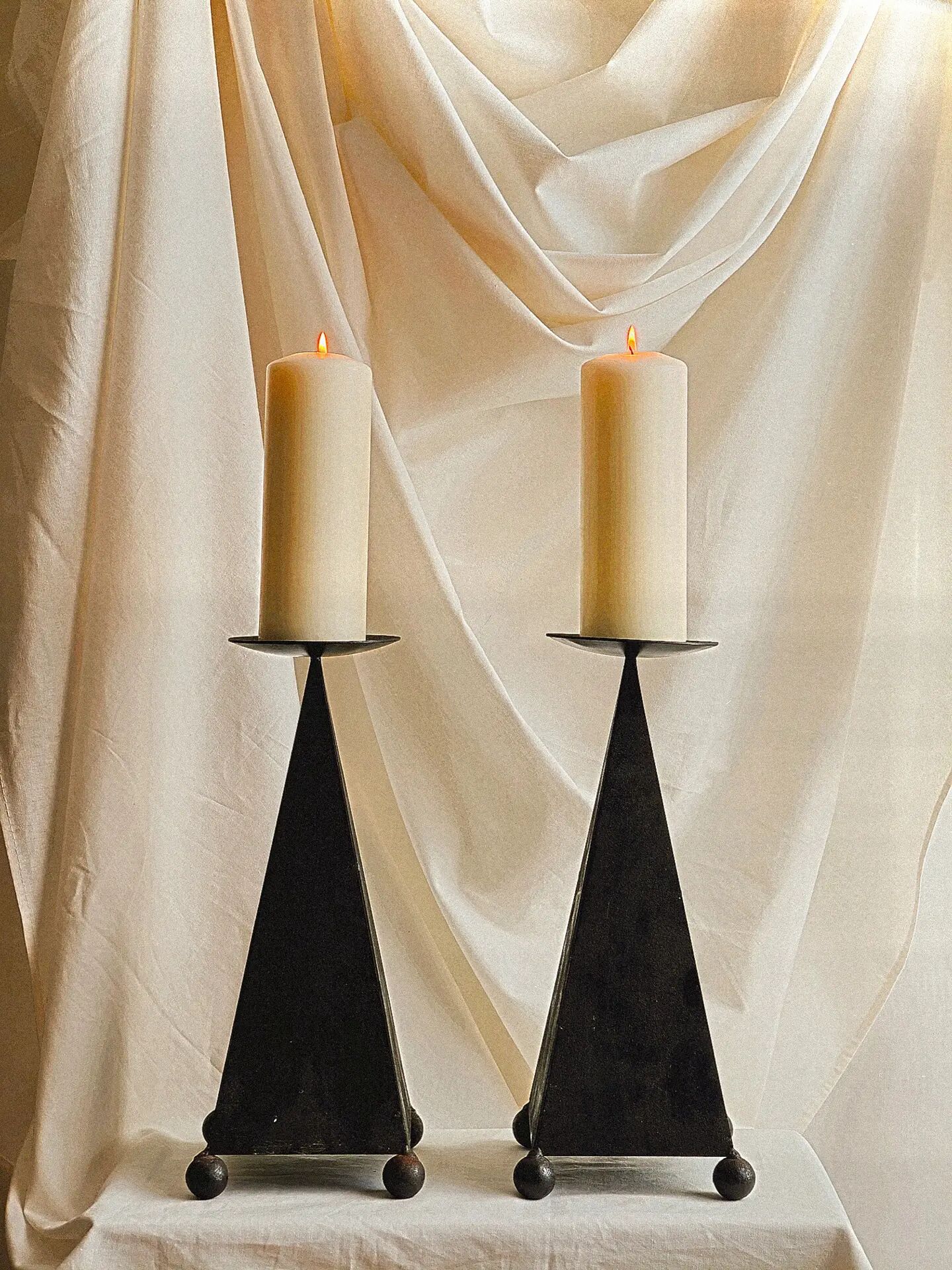 Pair of pyramid-shaped candlesticks in blackened metal (brutalism)