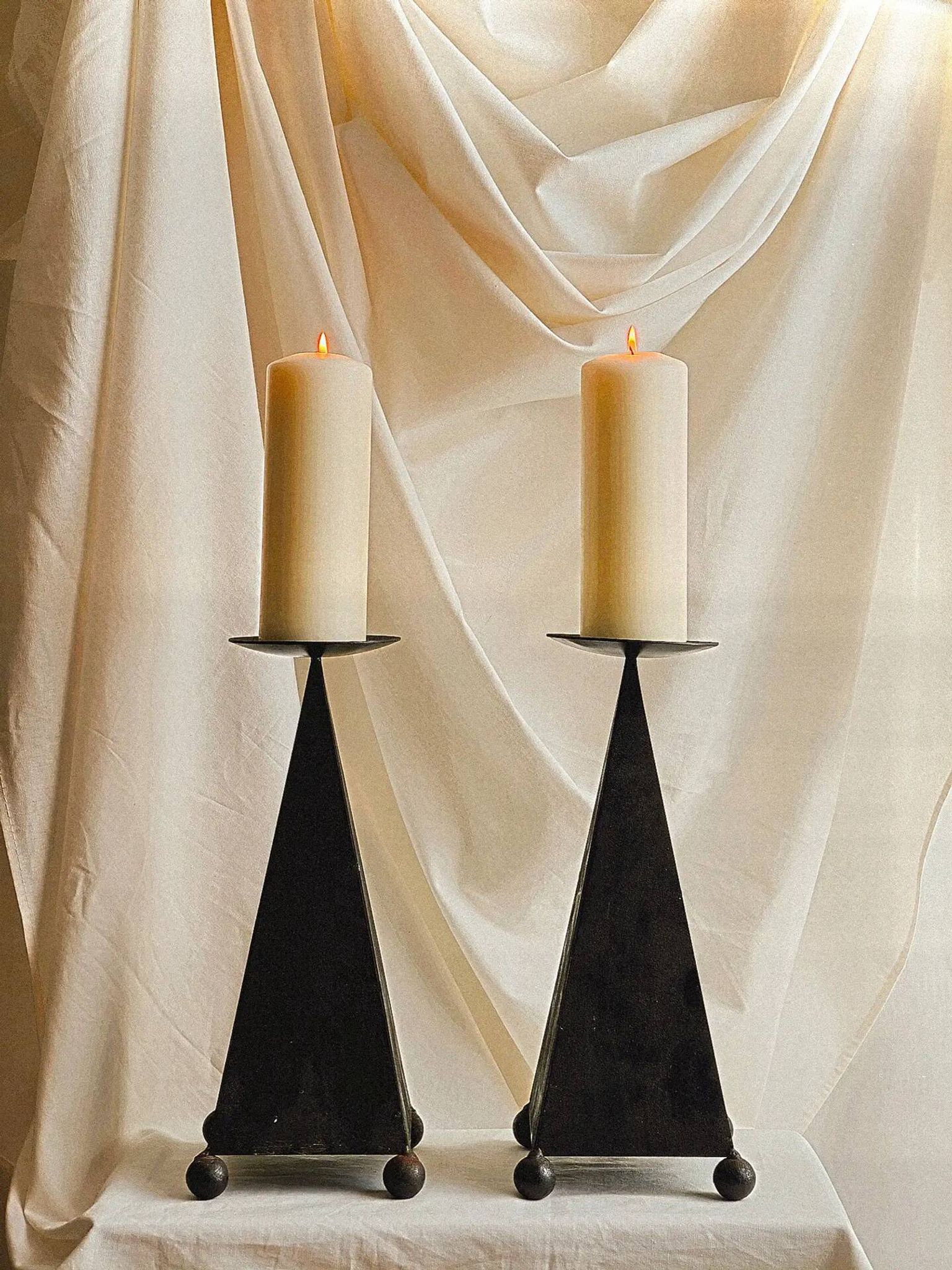 Pair of pyramid-shaped candlesticks in blackened metal (brutalism)
