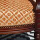 Old bench in wood and orange velvet