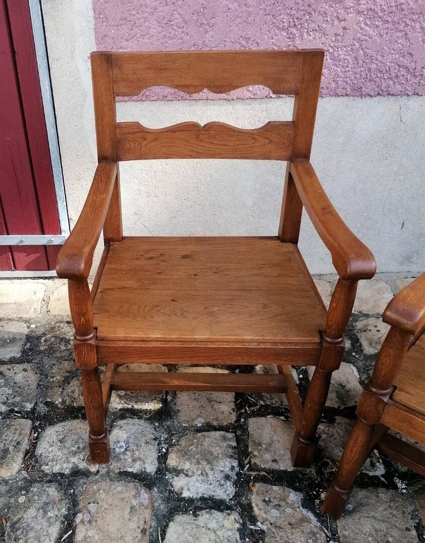 Pair of vintage oak armchairs with geometric design.