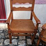 Pair of vintage oak armchairs with geometric design.