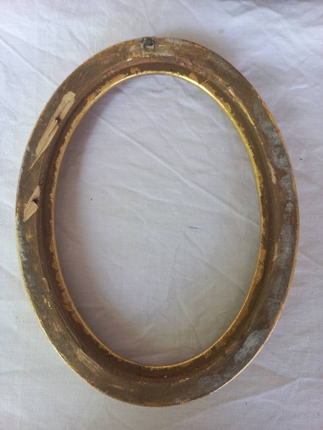 Golden oval frame