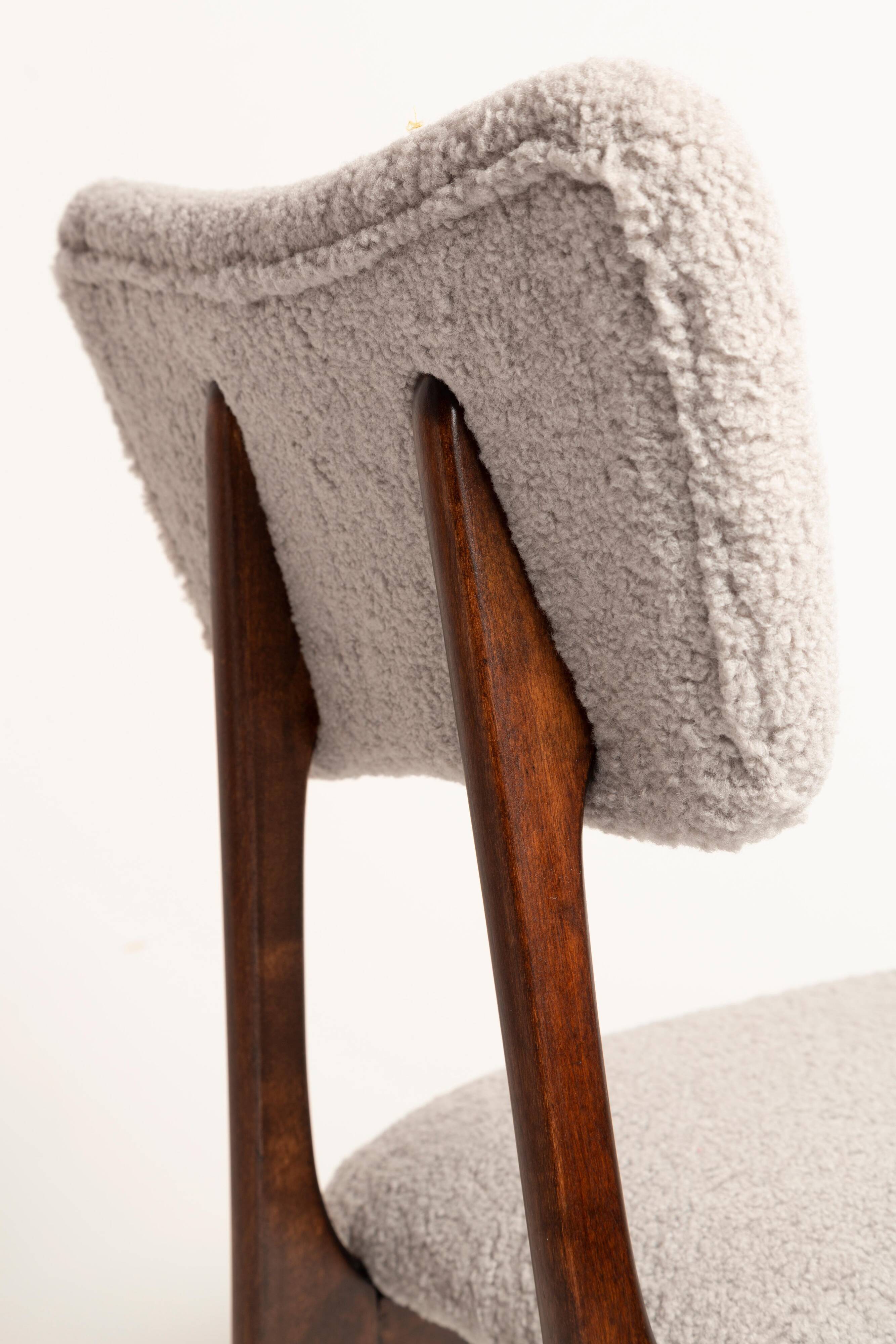 Mid-century butterfly chair, light grey boucle, dark walnut wood, Europe, 1960s.