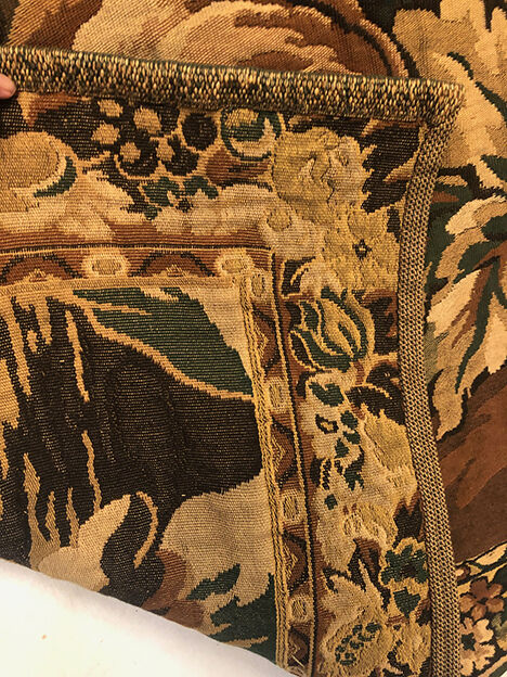Tapestry decorated with a pink flamingo in a green landscape, woven by hand