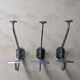 Three art deco coat hooks
