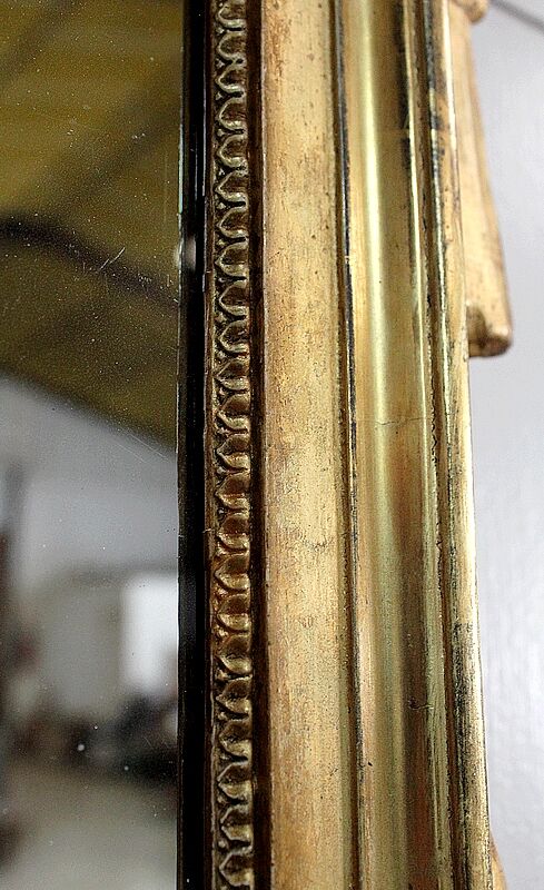 Miroir en bois doré, style Louis XVl, début XXe