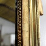 Miroir en bois doré, style Louis XVl, début XXe