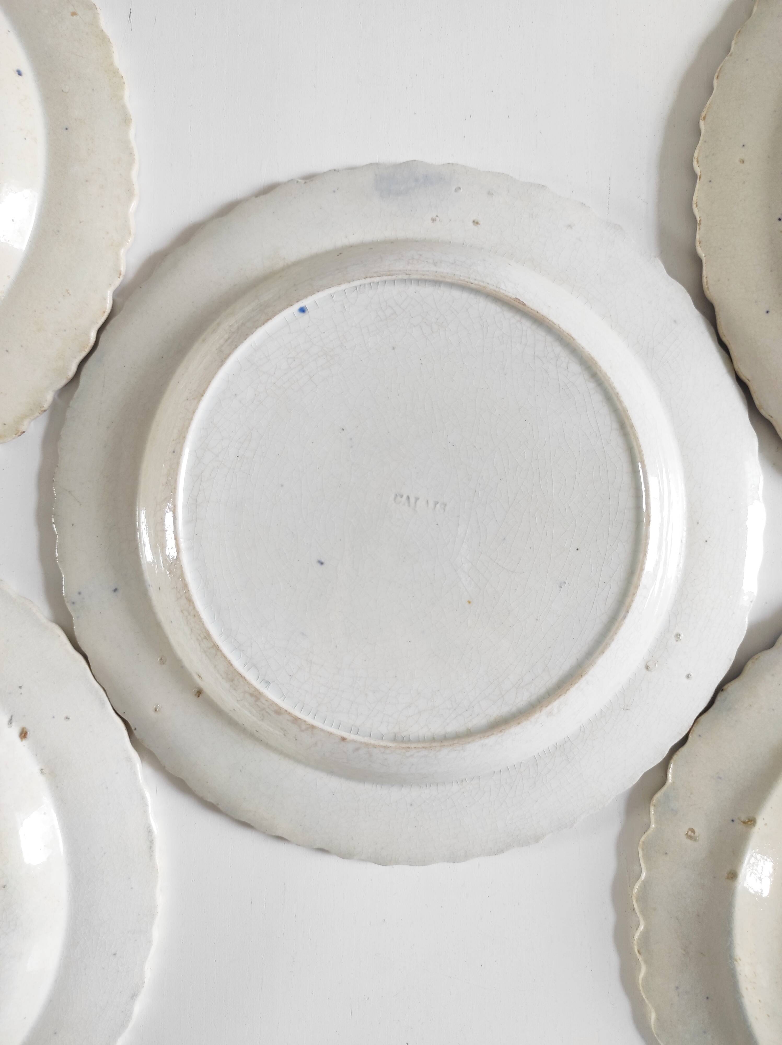 Five 19th century Calais earthenware plates with a romantic gallant couple decor