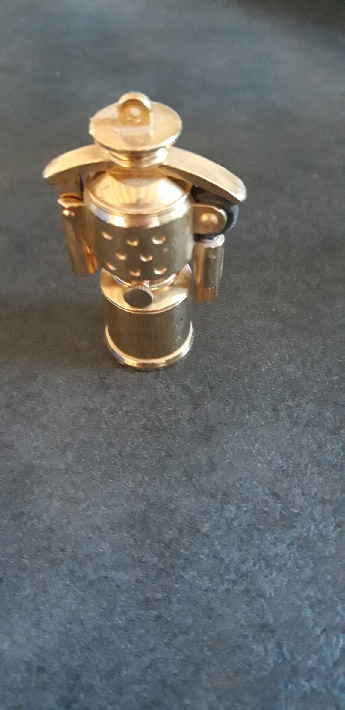 Old small golden storm gasoline lighter