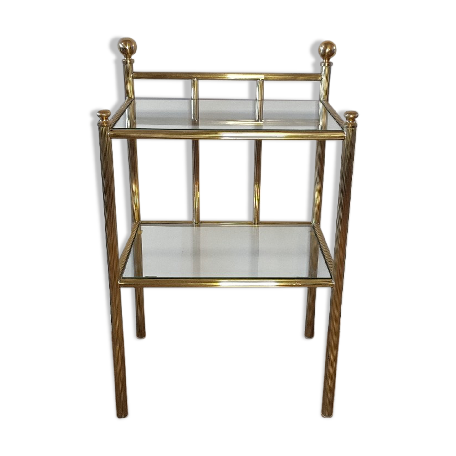 Bedside table in brass and glass.